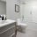 a bathroom with a glass shower/tub combo