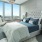 a bedroom with a large window