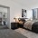 carpeted bedroom with city views