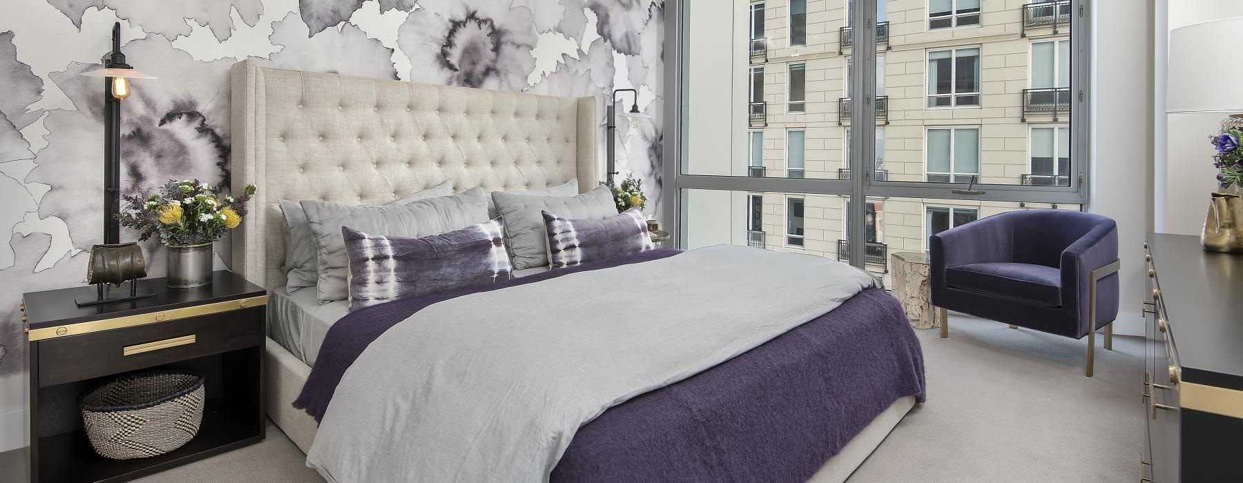 a bedroom with a bed and a chair