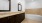 a bathroom with a tub, sink and mirror