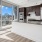 spacious kitchen with large windows offering city views