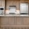 a kitchen with wooden cabinets