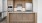 a kitchen with wooden cabinets