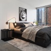 carpeted bedroom with city views