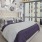 a bedroom with a bed and a chair