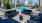 sitting area next to swimming pool